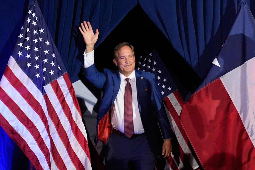 FILE - Texas Attorney General Ken Paxton, a Republican candidate for the U.S. Senate, waves as he takes the stage during a primary runoff election night event after winning the Republican party's nomination, May 26, 2026, in Plano, Texas. (AP Photo/Tony Gutierrez, File)