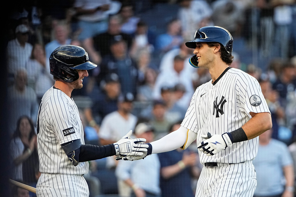 New York Yankees pitcher Spencer Jones, right, celebrates a solo home run during the first inning of a baseball game against the Chicago White Sox, Tuesday, June 16, 2026, in New York. (AP Photo/Eduardo Munoz Alvarez)