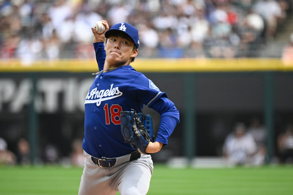 Los Angeles Dodgers pitcher Yoshinobu Yamamoto, of Japan, delivers during the first inning of a baseball game against the Chicago White Sox, Saturday, June 13, 2026, in Chicago. (AP Photo/Matt Marton)