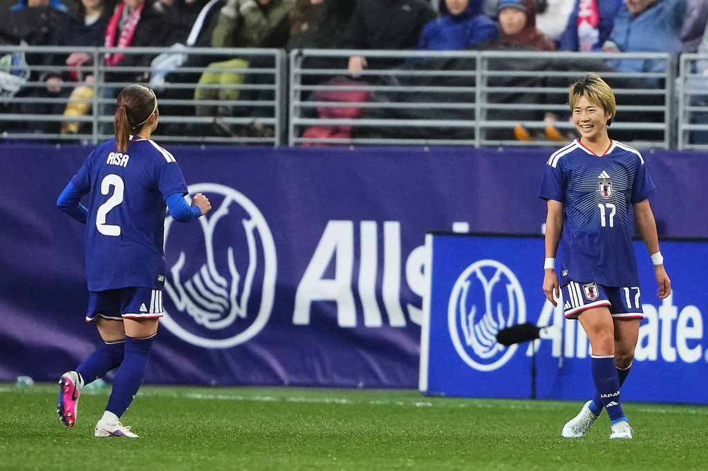 Japan midfielder Maika Hamano (17) celebrates with defender Risa Shimizu (2) after scoring against the United States during the first half of an international friendly soccer match Tuesday, April 14, 2026, in Seattle. (AP Photo/Lindsey Wasson)