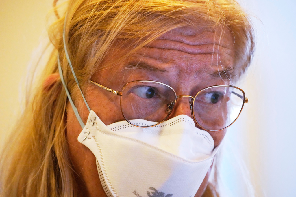 Marsha Luce, a patient at Ammonoosuc Community Health Services, wears a mask to avoid spreading her cold while volunteering at a local church, Wednesday, Oct. 22, 2025, in Franconia, N.H. (AP Photo/Robert F. Bukaty)