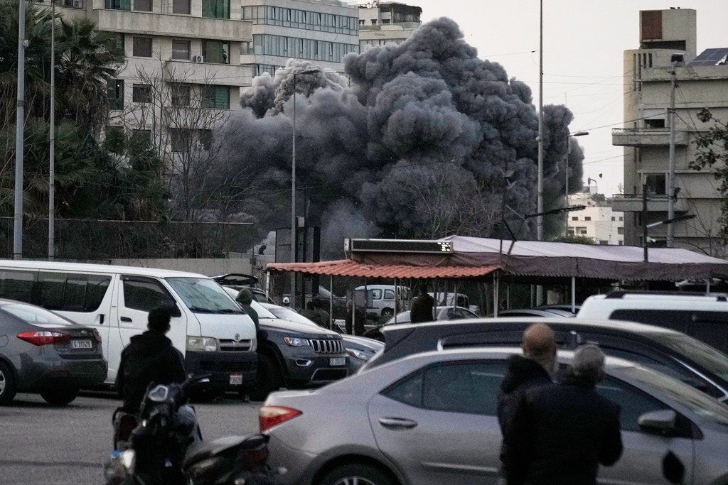 Smoke rises from a building after an Israeli targeted strike in central Beirut, Lebanon, Thursday, March 12, 2026.(AP Photo/Bilal Hussein)