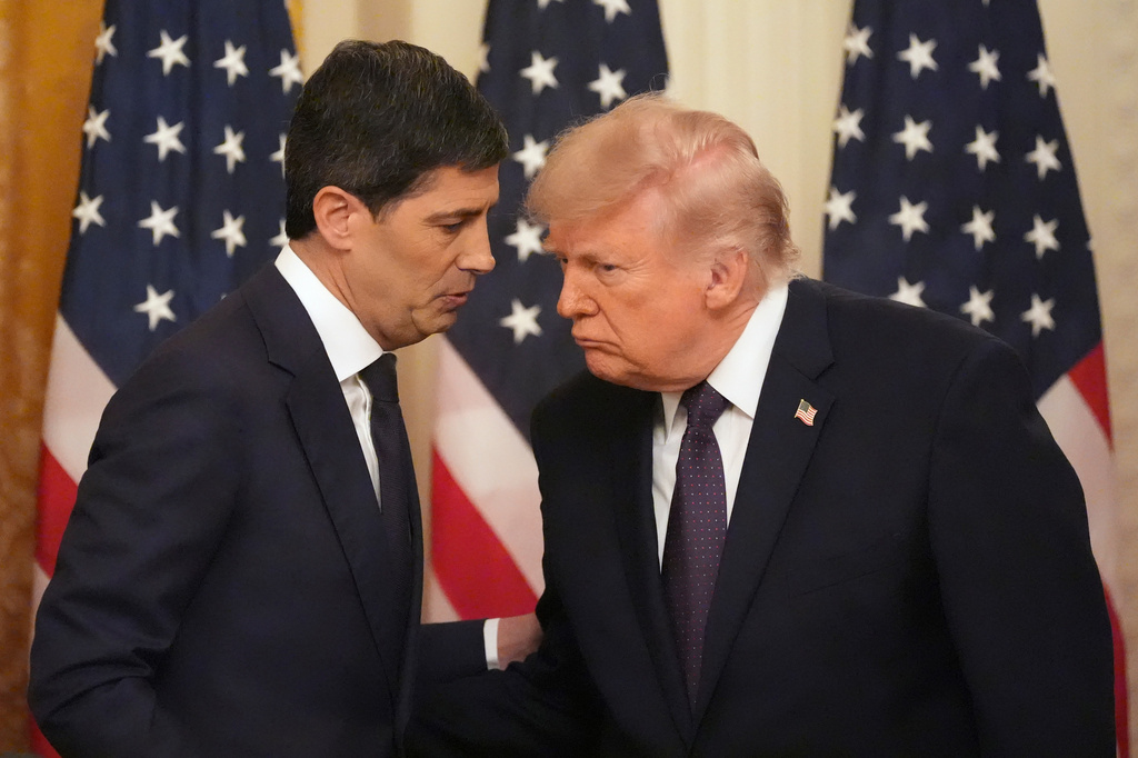 President Donald Trump, right, speaks with Federal Reserve Chairman Kevin Warsh during Warsh's swearing-in in the East Room of the White House, Friday, May 22, 2026, in Washington. (AP Photo/Alex Brandon)