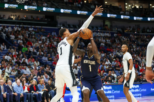 New Orleans Pelicans forward Zion Williamson (1) tries to make a move against San Antonio Spurs forward Victor Wembanyama (1) during the first half of an NBA basketball game Friday, Oct. 24, 2025, in New Orleans. (AP Photo/Peter Forest) New Orleans Pelicans forward Zion Williamson (1) tries to make a move against San Antonio Spurs forward Victor Wembanyama (1) during the first half of an NBA basketball game Friday, Oct. 24, 2025, in New Orleans. (AP Photo/Peter Forest)
