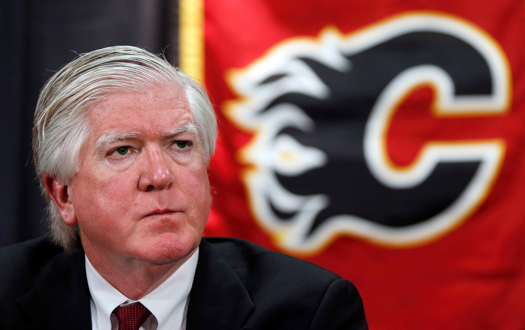 FILE - New Calgary Flames President of Hockey Operations Brian Burke listens to a question during a news conference in Calgary, Alberta, Sept. 5, 2013. (Jeff McIntosh/The Canadian Press via AP)