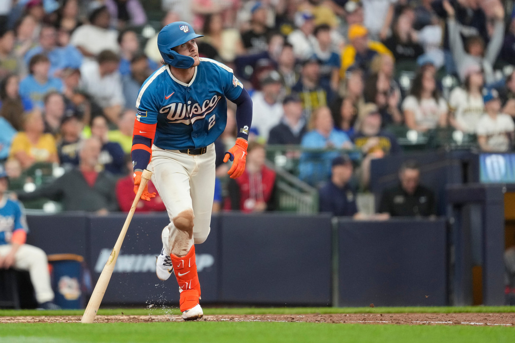 Milwaukee Brewers' Brice Turang watches his solo home run during the fifth inning of a baseball game against the Washington Nationals, Sunday, April 12, 2026, in Milwaukee. (AP Photo/Aaron Gash)