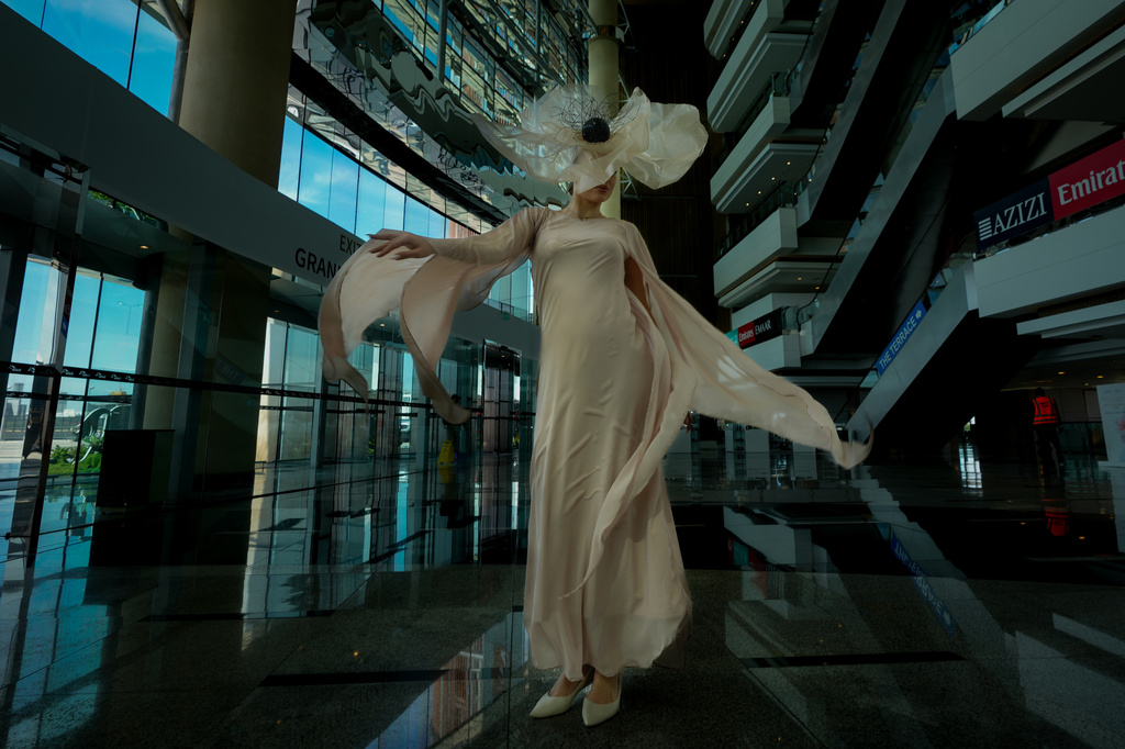 An artist performs at the grandstand ahead of Dubai World Cup at the Meydan racecourse in Dubai, United Arab Emirates, Saturday, March 28, 2026. (AP Photo/Altaf Qadri)