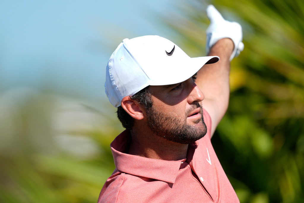 Scottie Scheffler, of the United States, reacts after his drive on the fourth hole during the second round of the Hero World Challenge PGA Tour at the Albany Golf Club, in New Providence, Bahamas, Friday, Dec. 5, 2025. (AP Photo/Fernando Llano)