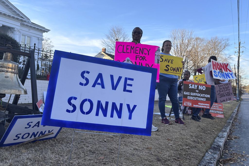 People gather outside the Alabama Governor's Mansion in Montgomery, Ala., on Feb. 16, 2026, to urge Gov. Kay Ivey to grant clemency to Sonny Burton, who is scheduled to be executed on March 12, 2026. (AP Photo/Kim Chandler)