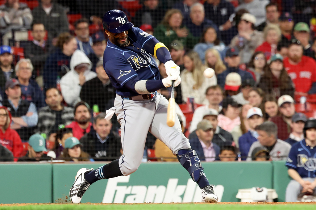 Tampa Bay Rays designated hitter Yandy Díaz hits a ground rule double during the ninth inning of a baseball game against the Boston Red Sox, Thursday, May 7, 2026, in Boston. (AP Photo/Mark Stockwell)