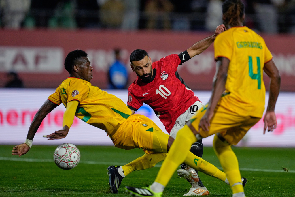 Egypt's Mohamed Salah scores during the Africa Cup of Nations group B soccer match between Egypt and Zimbabwe in Agadir, Morocco, Monday, Dec. 22, 2025. (AP Photo/Mosa'ab Elshamy)