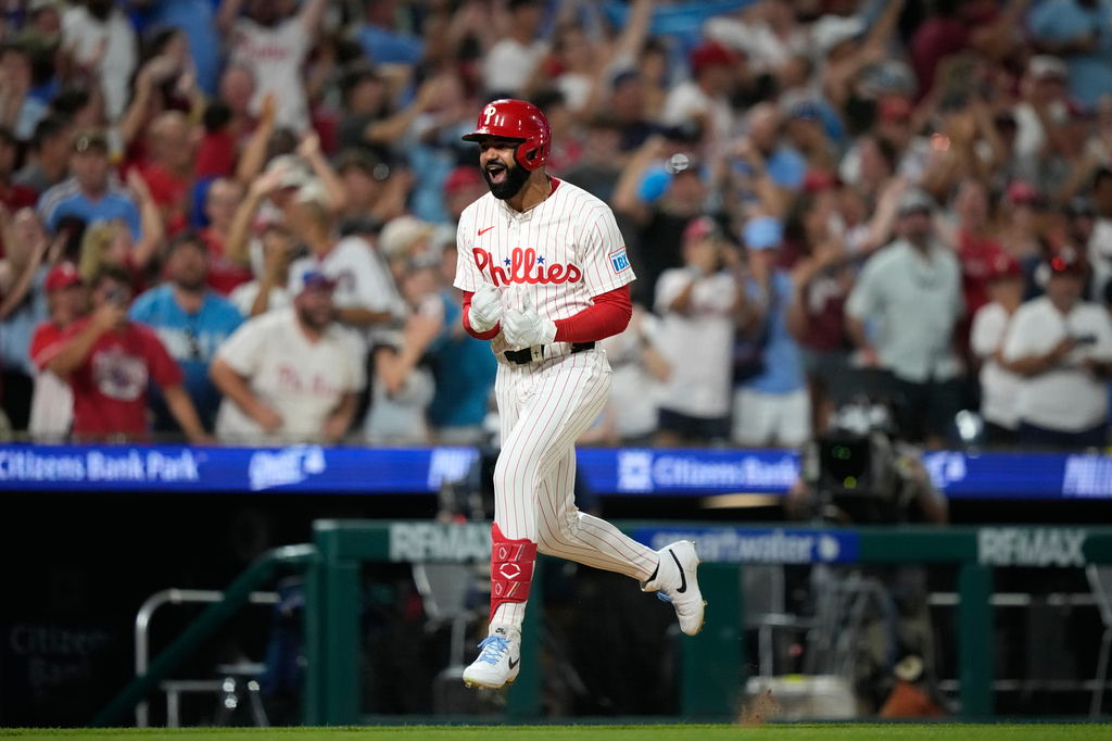 Philadelphia Phillies' Derek Hill reacts after hitting a grand slam against Washington Nationals pitcher Tom Cosgrove during the seventh inning of a baseball game Monday, Aug. 3, 2026, in Philadelphia. (AP Photo/Matt Slocum)