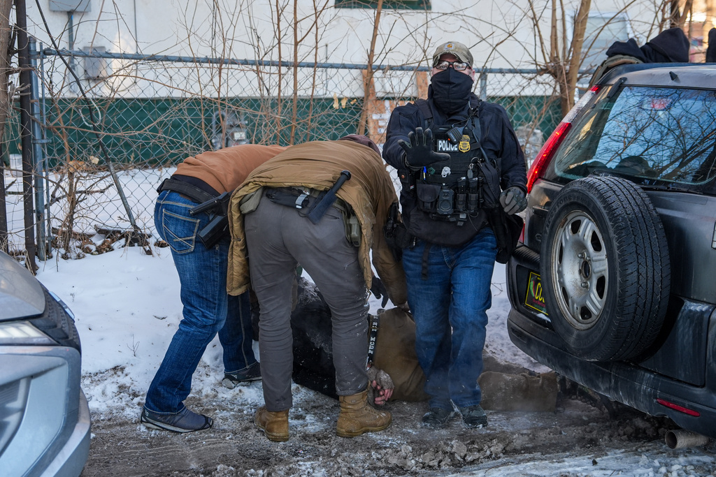 An activist is detained by federal agents on Tuesday, Feb. 3, 2026, in Minneapolis. (AP Photo/Ryan Murphy)