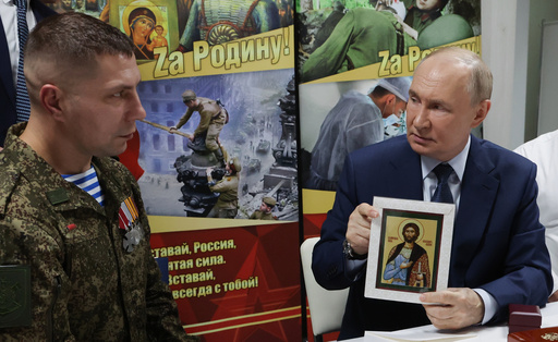President Vladimir Putin holds the Russian Orthodox the icon of the Holy Blessed Prince Alexander Nevsky as he meets with soldiers wounded in action in Ukraine at the the Mandryk Central Military Clinical Hospital, in Moscow, Russia, Wednesday, Oct. 29, 2025. (Vyacheslav Prokofyev, Sputnik, Kremlin Pool Photo via AP) President Vladimir Putin holds the Russian Orthodox the icon of the Holy Blessed Prince Alexander Nevsky as he meets with soldiers wounded in action in Ukraine at the the Mandryk Central Military Clinical Hospital, in Moscow, Russia, Wednesday, Oct. 29, 2025. (Vyacheslav Prokofyev, Sputnik, Kremlin Pool Photo via AP)