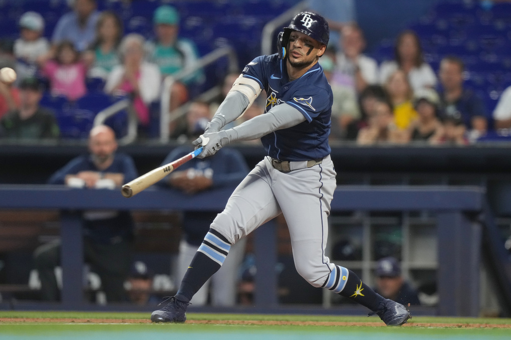 Tampa Bay Rays Victor Mesa Jr. hits a single to right field during the second inning of a baseball game against the Miami Marlins Sunday, June 7, 2026, in Miami. (AP Photo/Marta Lavandier)
