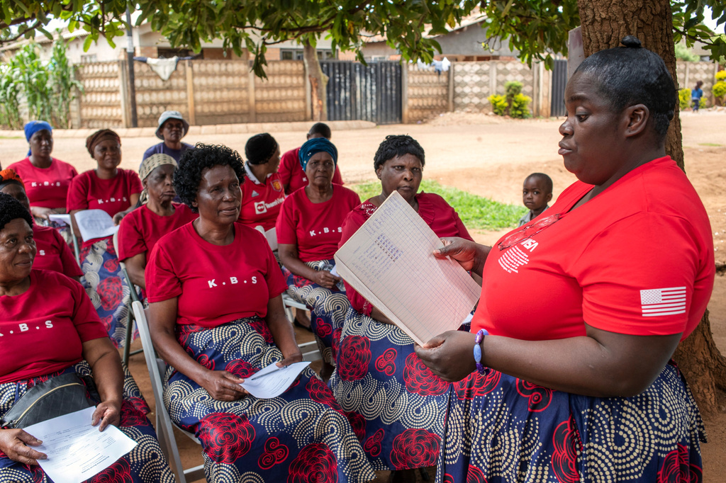 Kuchemana Burial Society secretary Nyadzisayi Mirisawu addresses fellow members at a meeting in Harare, Zimbabwe, March 13, 2026. (AP Photo/Aaron Ufumeli)