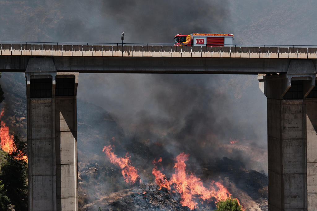 A firefighter truck next to a wildfire in Los Gallardos, near Almeria, Spain, Friday, July 10, 2026. (AP Photo/Gregorio Marrero)
