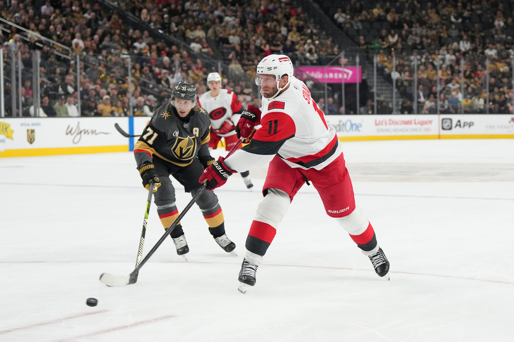 FILE - Carolina Hurricanes center Jordan Staal (11) shoots against Vegas Golden Knights center William Karlsson (71) during the third period of an NHL hockey game, Oct. 20, 2025, in Las Vegas. (AP Photo/Candice Ward, file)