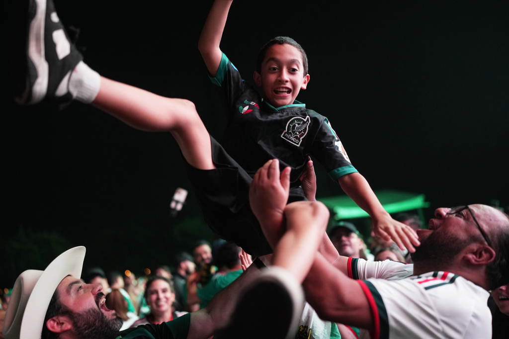 Fans celebrate in a fan zone in Monterrey, Mexico, after Mexico defeated South Korea in a World Cup Group A soccer match in Zapopan, Mexico, Thursday, June 18, 2026. (AP Photo/Matias Delacroix)