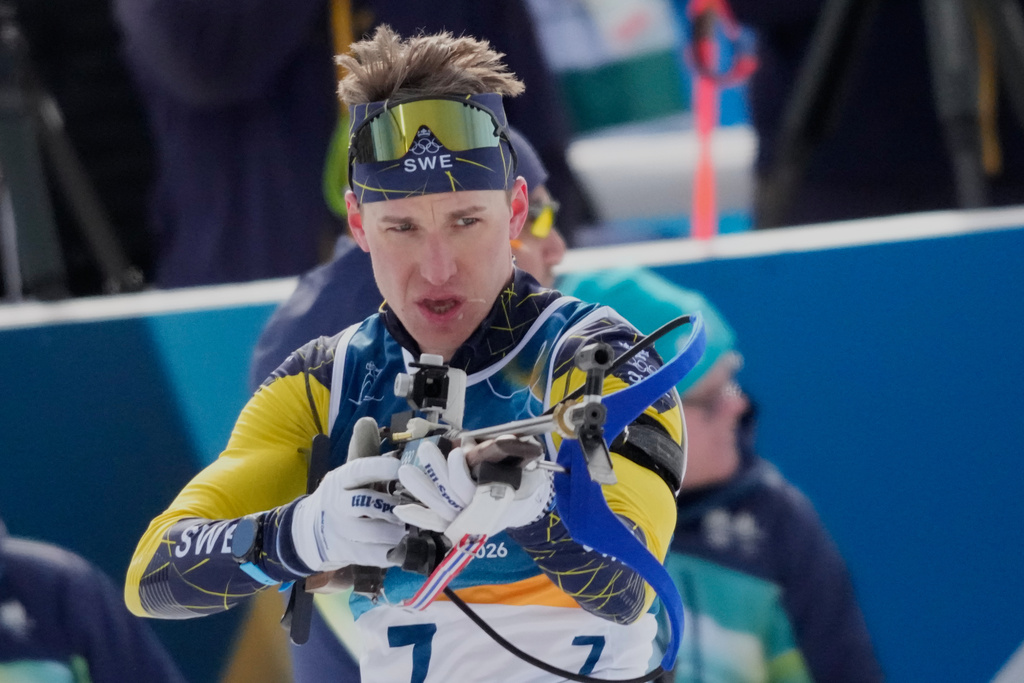 Martin Ponsiluoma of Sweden competes during the biathlon Men's 12.5km pursuit at the 2026 Winter Olympics, in Anterselva, Italy, Sunday, Feb. 15, 2026. (AP Photo/Christophe Ena)