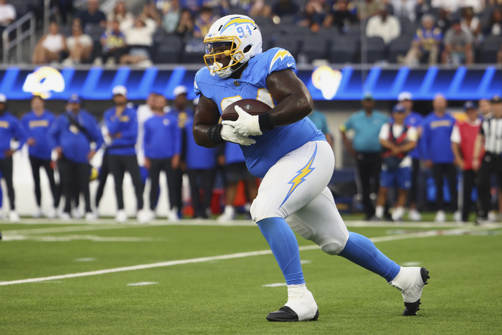 Los Angeles Chargers defensive tackle TeRah Edwards runs after intercepting a pass against the Los Angeles Rams during the second half of an NFL preseason football game, Saturday, Aug. 16, 2025, in Inglewood, Calif. (AP Photo/Jessie Alcheh)