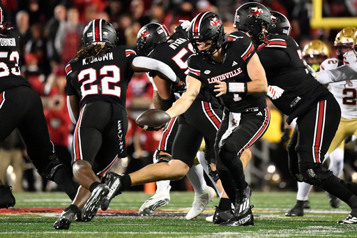 Louisville quarterback Miller Moss (7) hands the ball off to running back Keyjuan Brown (22) during the first half of an NCAA college football game against Boston College in Louisville, Ky., Saturday, Oct. 25, 2025. (AP Photo/Timothy D. Easley) Louisville quarterback Miller Moss (7) hands the ball off to running back Keyjuan Brown (22) during the first half of an NCAA college football game against Boston College in Louisville, Ky., Saturday, Oct. 25, 2025. (AP Photo/Timothy D. Easley)