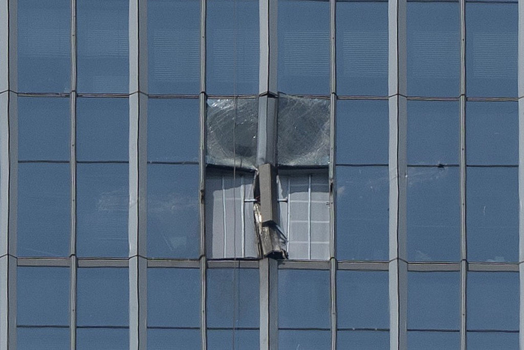 A section damaged after a small plane crashed into it is boarded up at the CITIC Tower, also known as China Zun, the tallest building in Beijing, on Saturday, June 27, 2026. (AP Photo/Ng Han Guan)