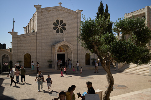 Palestinian parishioners stand outside Christ the Redeemer Church after attending a morning Mass in the West Bank village of Taybeh, Sept. 28, 2025. (AP Photo/Leo Correa) Palestinian parishioners stand outside Christ the Redeemer Church after attending a morning Mass in the West Bank village of Taybeh, Sept. 28, 2025. (AP Photo/Leo Correa)