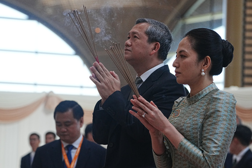 Cambodian Prime Minister Hun Manet, front left, prays together with his wife Pich Chanmony to inaugurate Techo International Airport in Kandal province, Cambodia, Monday, Oct. 20, 2025. (AP Photo/Heng Sinith) Cambodian Prime Minister Hun Manet, front left, prays together with his wife Pich Chanmony to inaugurate Techo International Airport in Kandal province, Cambodia, Monday, Oct. 20, 2025. (AP Photo/Heng Sinith)