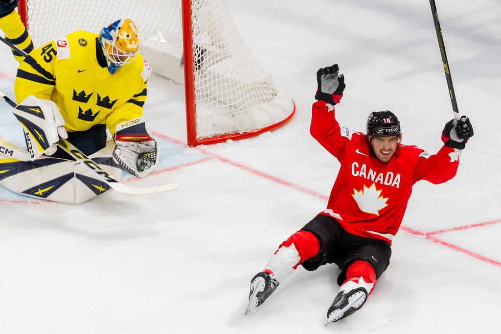 Canada's Robert Thomas celebrates after teammate Dylan Cozens scored a goal during a Group B preliminary round game between Canada and Sweden at the men's ice hockey world championship in Fribourg, Switzerland, Friday, May 15, 2026. (Salvatore Di Nolfi/Keystone via AP)