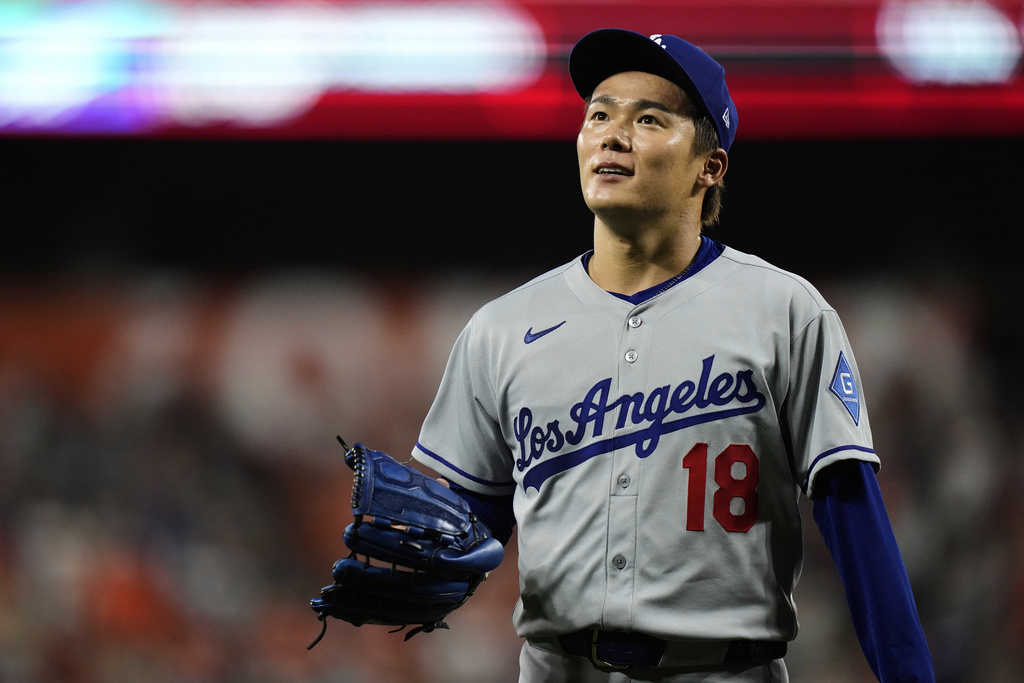 Los Angeles Dodgers starting pitcher Yoshinobu Yamamoto (18) leaves the mound after a pitching substitution in the ninth inning of a baseball game against the Baltimore Orioles, Saturday, Sept. 6, 2025, in Baltimore. (AP Photo/Stephanie Scarbrough)