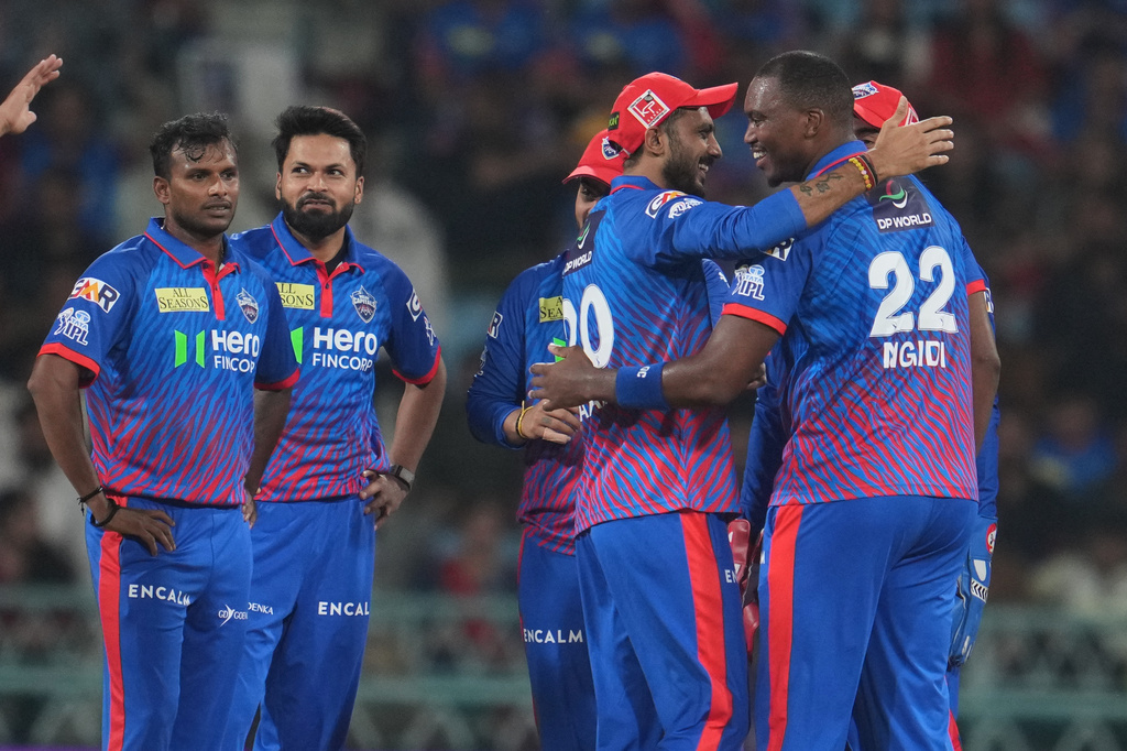 Delhi Capitals' Lungi Ngidi, right, celebrates with teammates the dismissal of Lucknow Super Giants' Nicholas Pooran during the Indian Premier League cricket match between Lucknow Super Giants and Delhi Capitals in Lucknow, India, Wednesday, April 1, 2026. (AP Photo/Manish Swarup)
