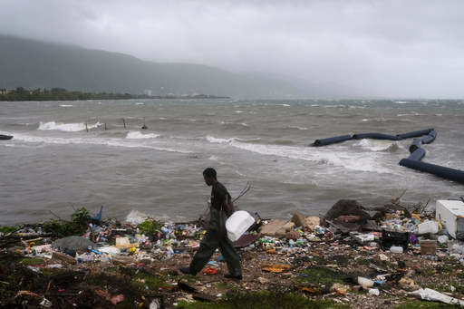 A man walks along the coastline during the passing of Hurricane Melissa in Kingston, Jamaica, Tuesday, Oct. 28, 2025. (AP Photo/Matias Delacroix) A man walks along the coastline during the passing of Hurricane Melissa in Kingston, Jamaica, Tuesday, Oct. 28, 2025. (AP Photo/Matias Delacroix)