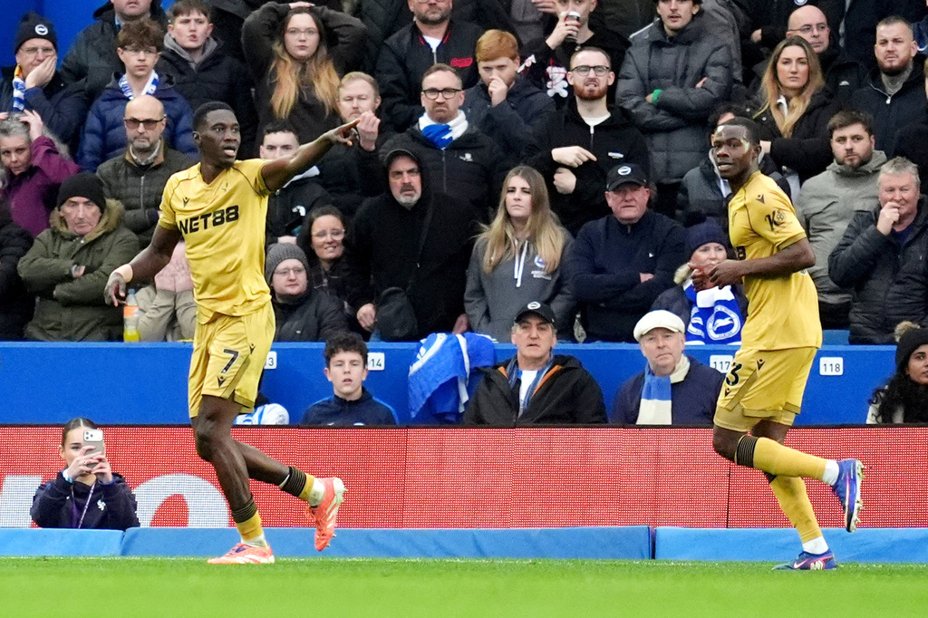 Crystal Palace's Ismaila Sarr, left, celebrates scoring their side's first goal of the game during their English Premier League soccer match against Brighton & Hove Albion in Brighton, England, Sunday, Feb. 8, 2026. (Adam Davy/PA via AP)
