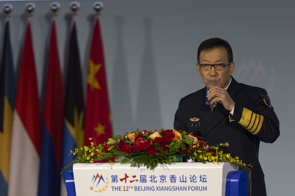 Chinese Defense Minister Dong Jun drinks from a glass during China's annual security and defense dialogue, the Xiangshan Forum, in Beijing, China, Thursday, Sept. 18, 2025. (AP Photo/Ng Han Guan)