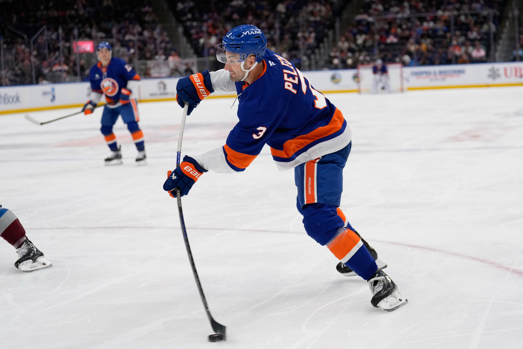 New York Islanders' Adam Pelech scores during the second period of an NHL hockey game against the Colorado Avalanche, Thursday, Dec. 4, 2025, in Elmont, N.Y. (AP Photo/Seth Wenig)