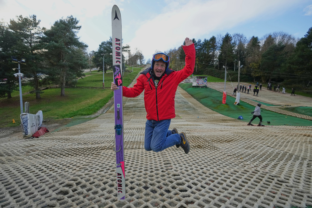 British former ski jumper Michael Edwards, known as Eddie the Eagle, poses for a photo at the Ski and Snowboard Center, in Gloucester, England, Wednesday, Nov. 19, 2025. (AP Photo/Frank Augstein)