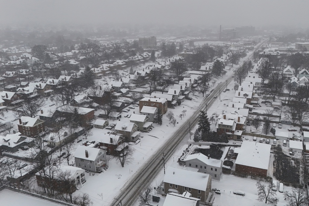 FILE - Snow covers homes during a winter storm in Cincinnati, Jan. 6, 2025. (AP Photo/Joshua A. Bickel, File)