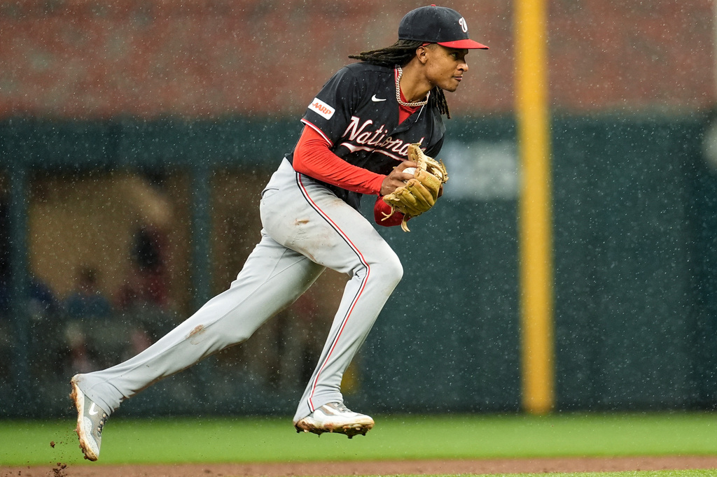 Washington Nationals shortstop CJ Abrams fields a ball hit by Atlanta Braves' Matt Olson (28) in the sixth inning of a baseball game, Sunday, May 24, 2026, in Atlanta. (AP Photo/Mike Stewart)