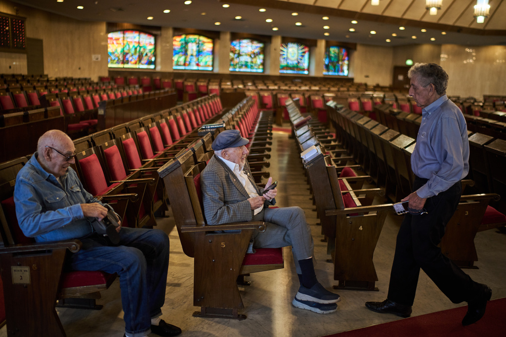 Holocaust survivors Walter Bingham, 101, center, George Shefi, 94, left, and Paul Alexander, 87, arrive for an interview at Jerusalem Great Synagogue in Jerusalem, Wednesday, Nov. 5, 2025, ahead the 87th anniversary of Kristallnacht or "Night of broken Glass," the November 1938 government-backed pogroms against Jews in Germany and Austria. (AP Photo/Leo Correa)