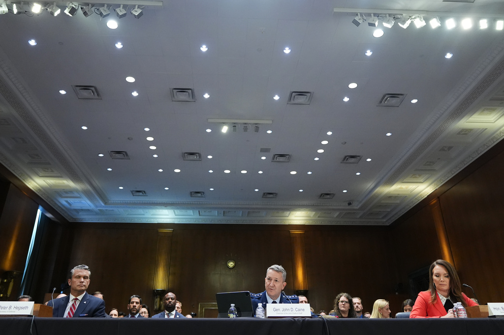 Defense Secretary Pete Hegseth, Chairman of the Joint Chiefs of Staff Gen. Dan Caine and Agriculture Secretary Brooke Rollins testify at a Senate Appropriations Committee hearing, Tuesday, July 21, 2026, on Capitol Hill in Washington. (AP Photo/Jacquelyn Martin)