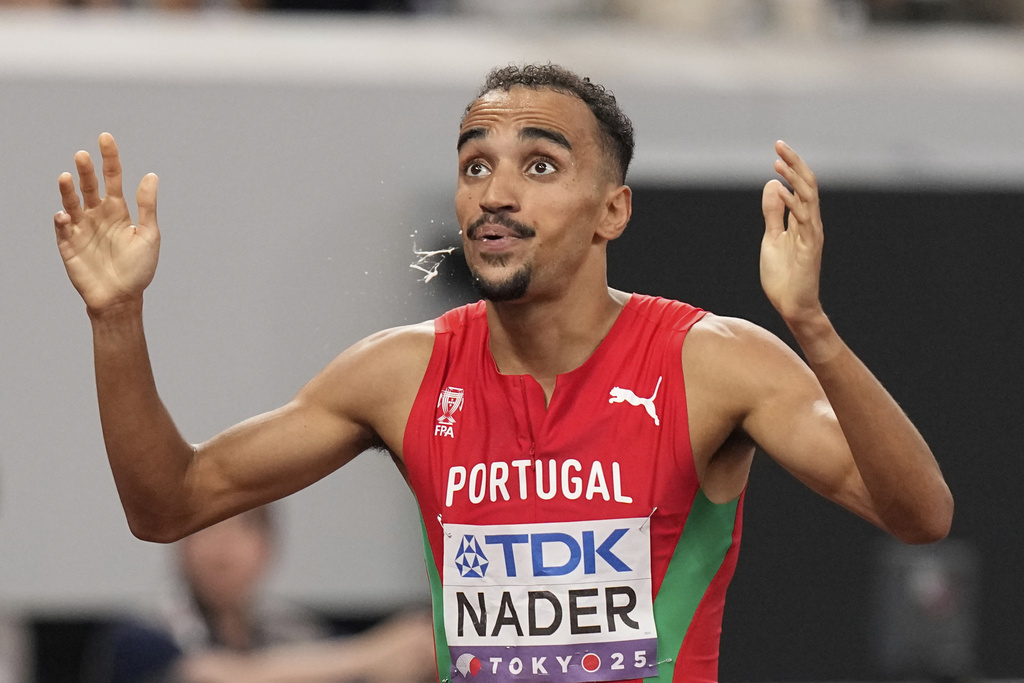 Portugal's Isaac Nader reacts after winning gold medal in the men's 1,500 meters final at the World Athletics Championships in Tokyo, Wednesday, Sept. 17, 2025. (AP Photo/Eugene Hoshiko)
