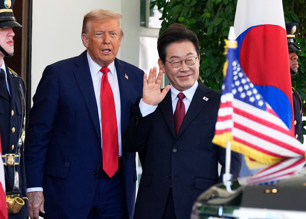 FILE - President Donald Trump, left, greets South Korean President Lee Jae Myung upon his arrival at the White House on Aug. 25, 2025, in Washington. (AP Photo/Alex Brandon, File)