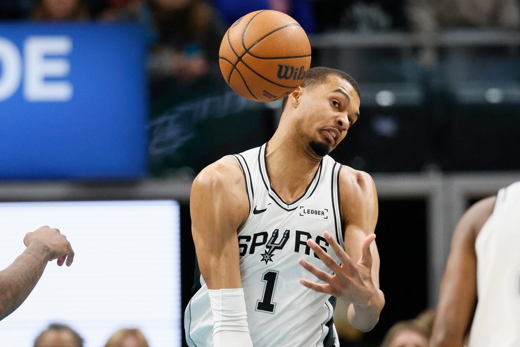 San Antonio Spurs forward Victor Wembanyama cannot grab a rebound during the first half of an NBA basketball game against the Detroit Pistons, Monday, Feb. 23, 2026, in Detroit. (AP Photo/Duane Burleson)