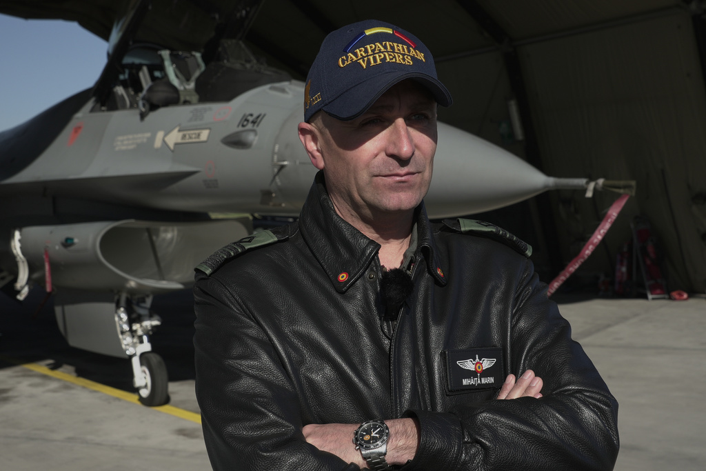 Romanian air force Col. Mihaita Marin, commander of a Romanian air wing of F-16 fighter jets deployed at the Siauliai Air Base in Lithuania on a NATO air-policing mission, speaks during an interview on Monday, April 20, 2026. (AP Photo/John Leicester)