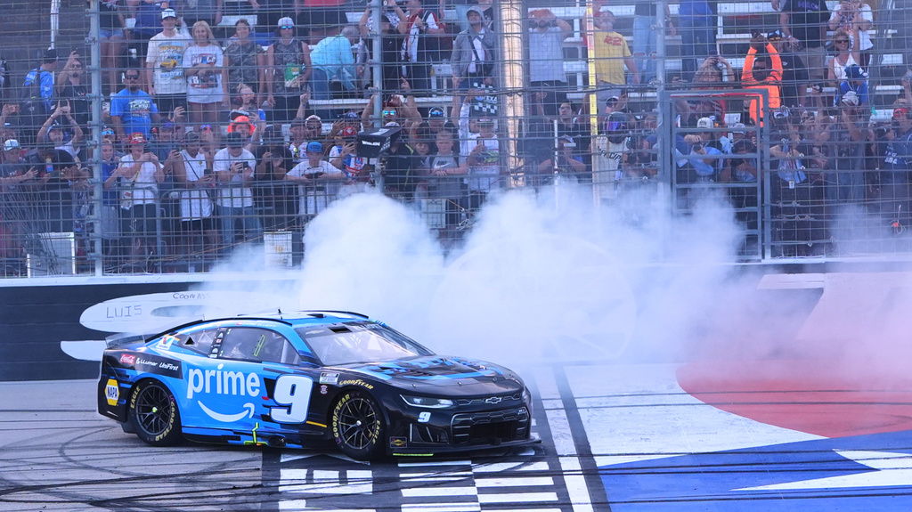 Chase Elliott does a burnout at the finish line after winning a NASCAR Cup Series auto race in Fort Worth, Texas, Sunday, May 3, 2026. (AP Photo/LM Otero)