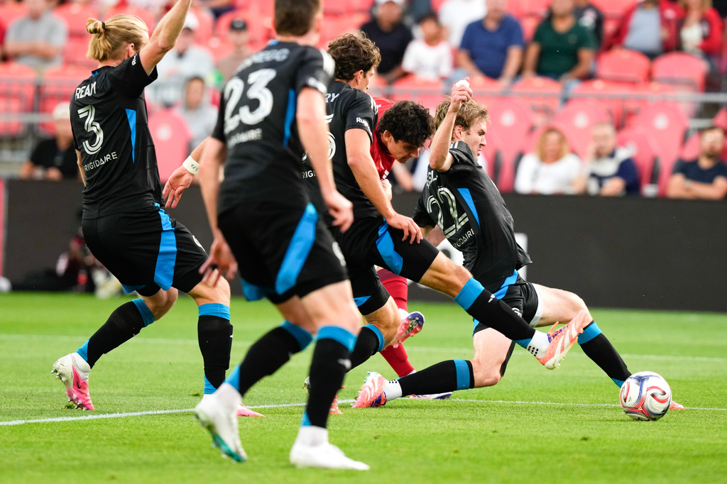 Toronto FC's Markus Cimermancic (second right) tries to get a shot a goal through the Charlotte FC defence during the first half of a MLS soccer game in Toronto, Wednesday, Aug. 19, 2026. (Chris Young/The Canadian Press via AP)