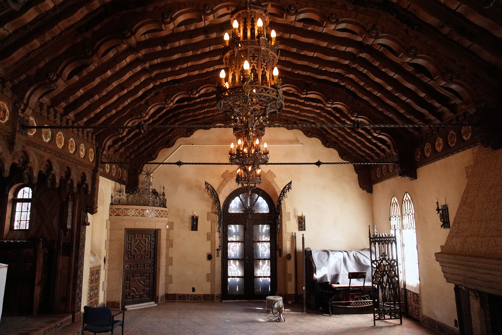 Chandeliers and sunlight illuminate a room at Scotty's Castle, Friday, Jan. 23, 2026, in Death Valley National Park, Calif. (AP Photo/John Locher)