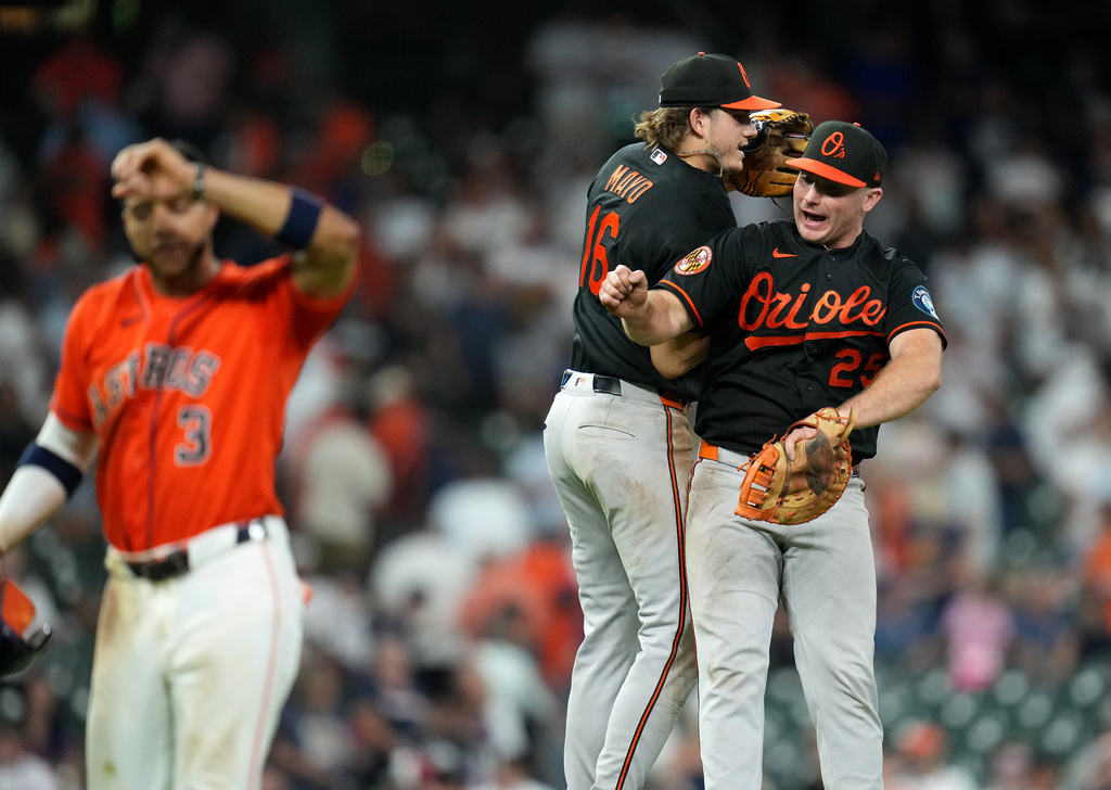 Baltimore Orioles' Coby Mayo, left, and Pete Alonso, right, celebrate their win over the Houston Astros after a baseball game, Friday, July 17, 2026, in Houston. (AP Photo/Karen Warren)