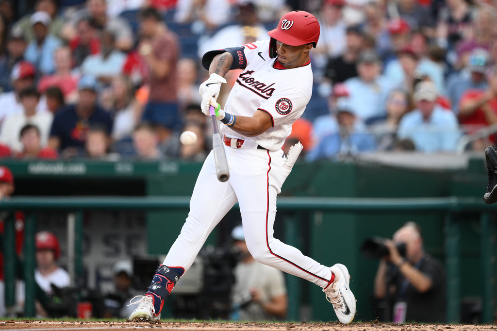 Washington Nationals' Daylen Lile hits a double driving in a run during the third inning of a baseball game against the Houston Astros, Wednesday, July 8, 2026, in Washington. (AP Photo/Nick Wass)